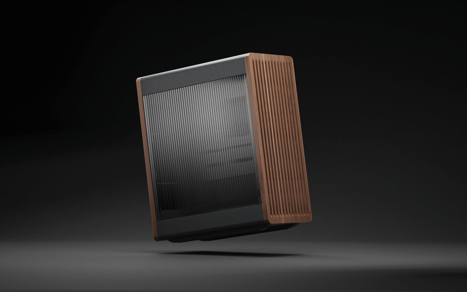 E32B computer case front view showing tempered glass panel and walnut wood side