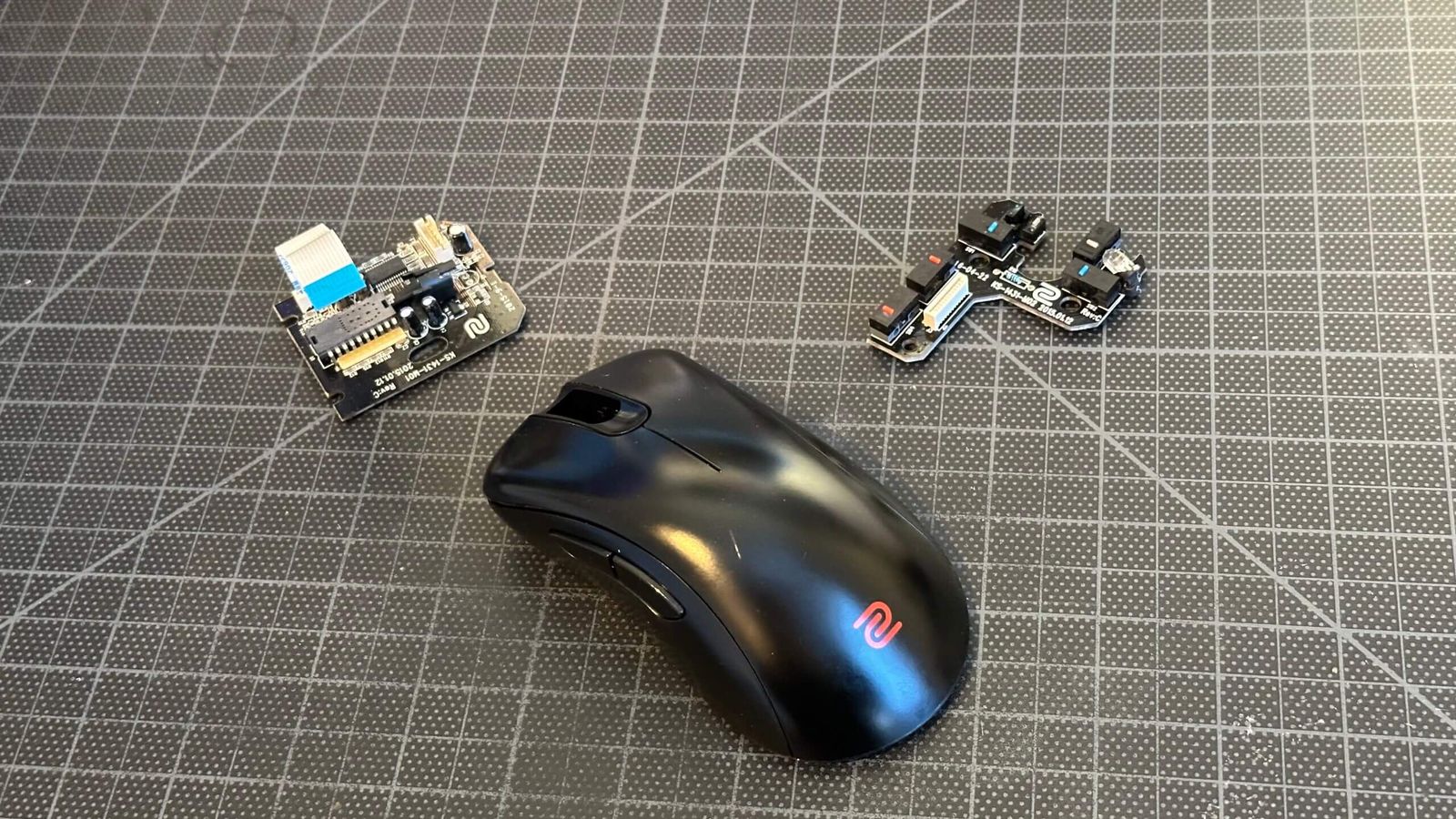 Gaming mouse opened up for repair, interior cleaned with isopropyl alcohol to access the faulty switch