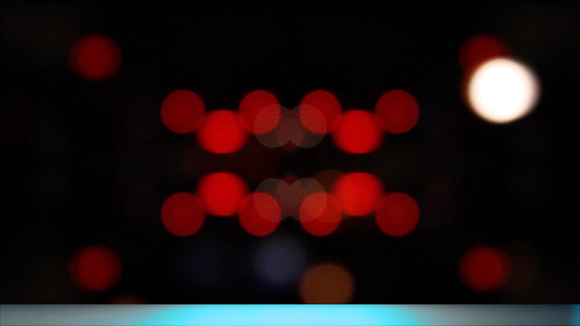 Soft gradient of blurred pink and green neon from Times Square billboards