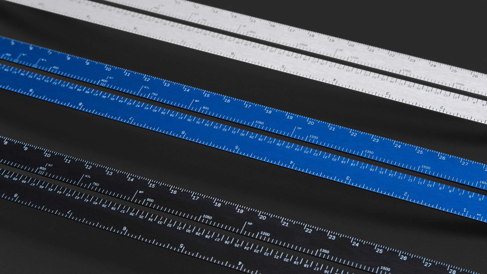 Close-up of the three LindLund rulers showing measurement markings