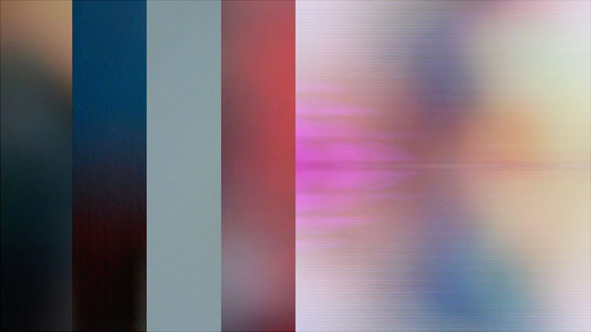 Layered vertical colour bands from out-of-focus Times Square signage